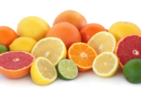 Citrus fruit collection with ruby red and yellow grapefruit, orange, lime and  lemons, whole and in halves, isolated over white background.