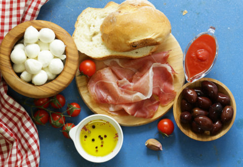 Italian food - olives, parma ham, tomatoes, mozzarella cheese